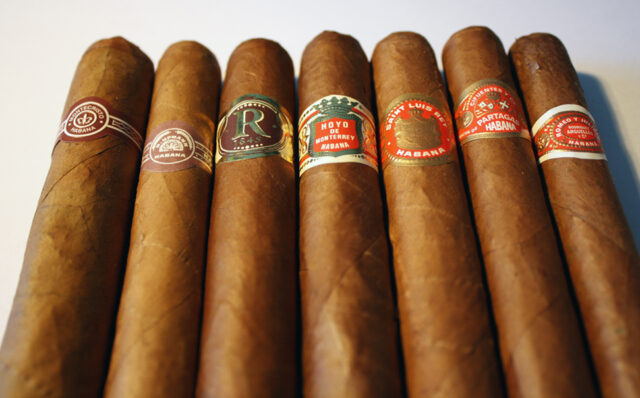 Lineup of Cuban Habanos cigars in various shapes and sizes