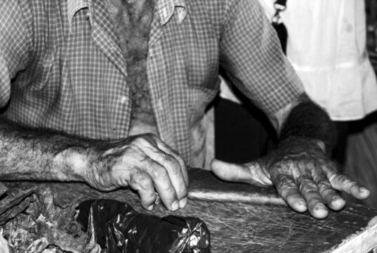 Why a $15 Cigar Costs $15 A Cuban tobacco farmer hand-rolling a cigar